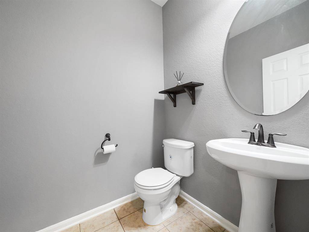 Half Bath located right around the corner from the Kitchen.