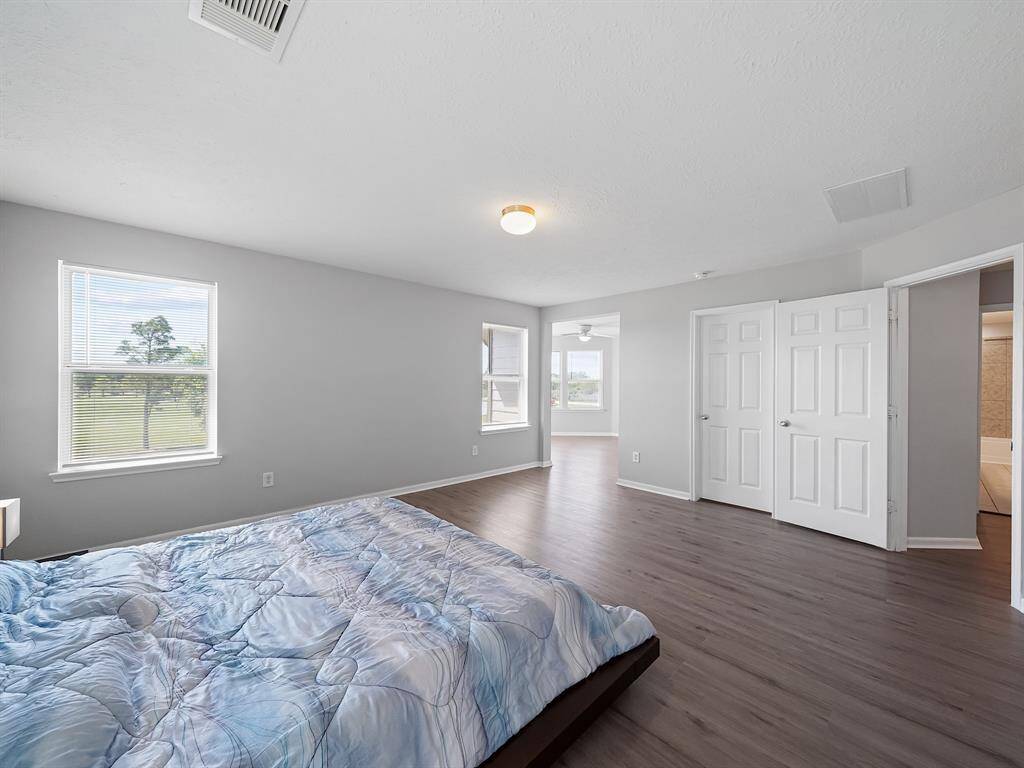 Primary bedroom! Within the room there is a large nook perfect for additional seating or baby crib.