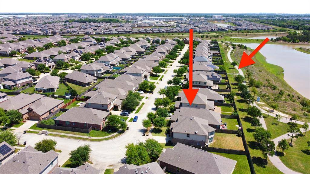 Aerial photo showcasing the property with No back neighbors and a short walk to the walking path to the park from the home!