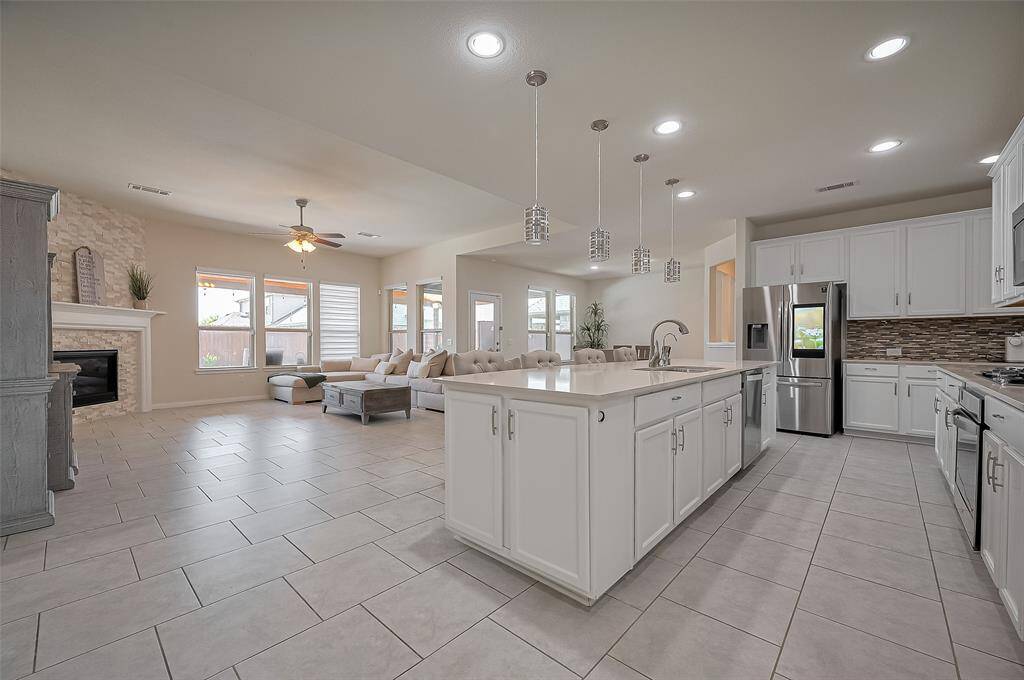 Breakfast Area to Living View:This open-concept space perfectly blends the kitchen, dining, and living areas, offering excellent sightlines and an inviting atmosphere for family and friends.