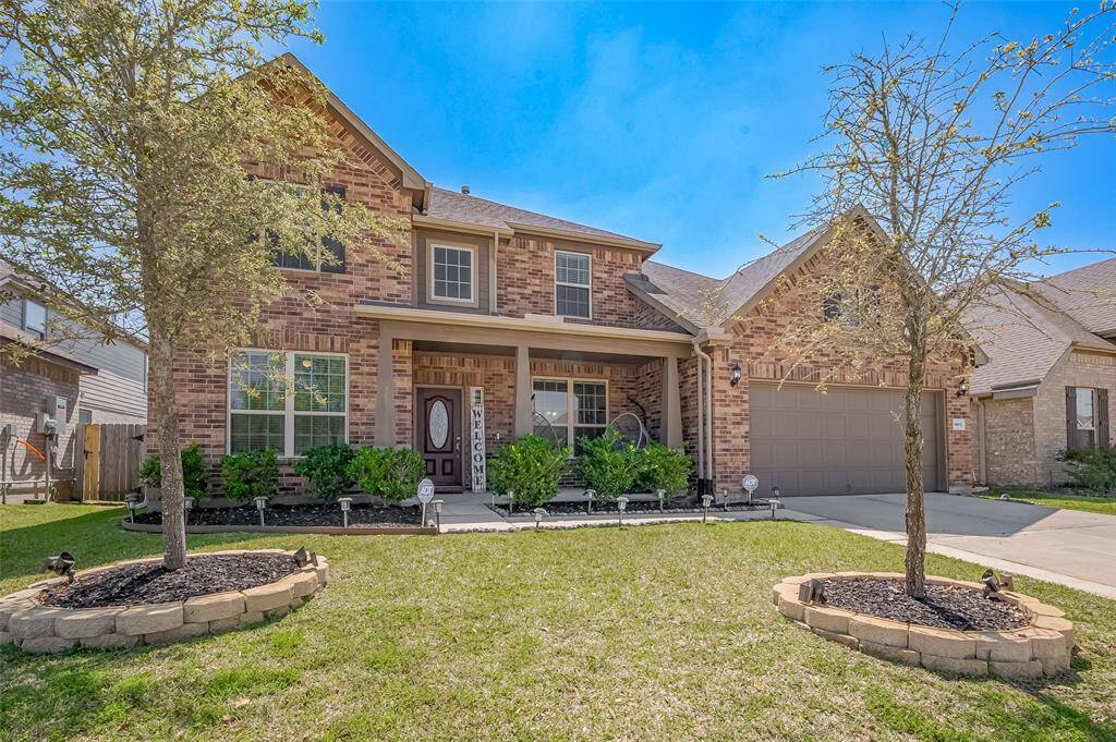 Welcome to your new home in the desirable Kings Crossing community! This stunning two-story brick exterior offers classic curb appeal with mature landscaping, a charming covered porch, and a spacious driveway leading to a three-car garage.