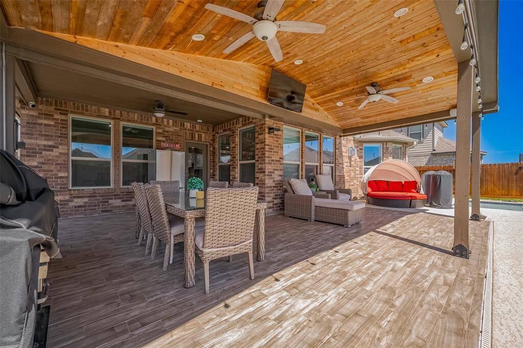 Enjoy the perfect blend of indoor-outdoor living with views of your sparkling pool just steps away. This patio seamlessly transitions to the backyard oasis, offering a resort-style atmosphere from the comfort of home.