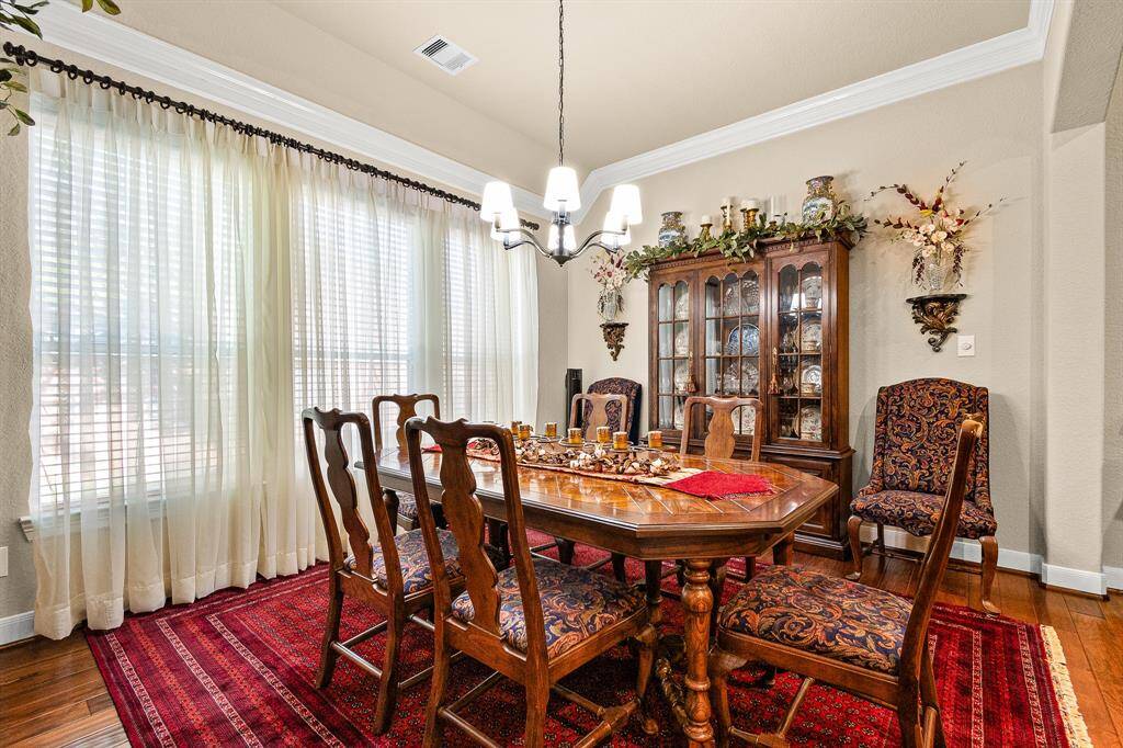 As you enter your new home, you'll be greated with this elegant Dining room, while notice the crown molding and beautiful windows.
