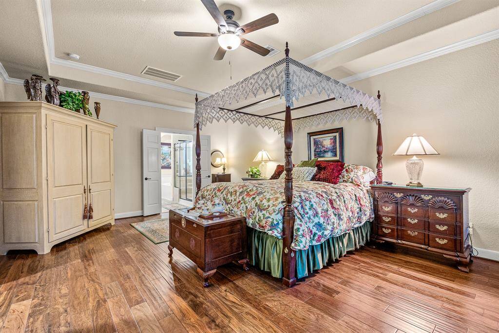 This spacious Primary Suite Bedroom features a sitting area and charming space to unwind with hardwood floors. You will have plenty of space for your furniture.