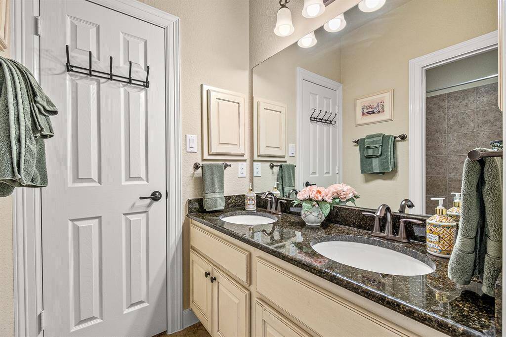 Hollywood Bathroom (Jack n Jill Bathroom) that adjoins to Bedroom 2 & 3.  It offers double sinks and a bathtub.