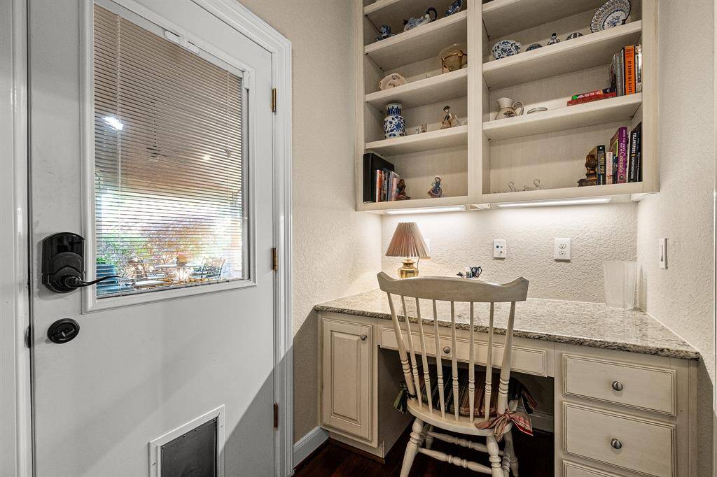 Discover a cozy workspace nook conveniently located by the two bedrooms, with easy access to the outdoor patio.