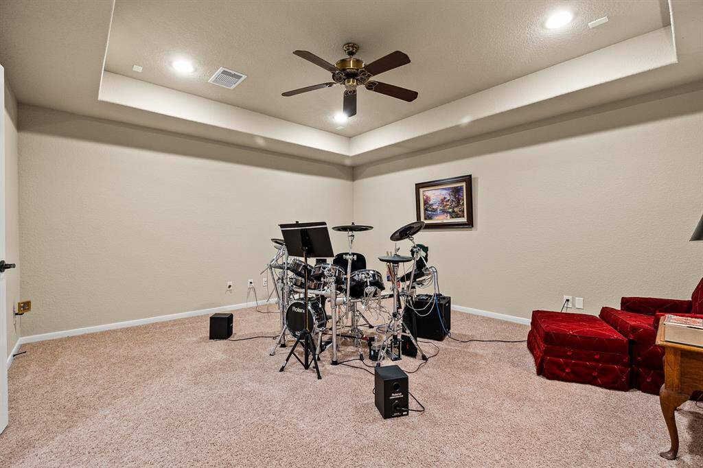 Your spacious Media Room is currently being used for a music or entertainment area.  It can be used as a Bedroom.  It's versatile space for relaxation or hobbies.
