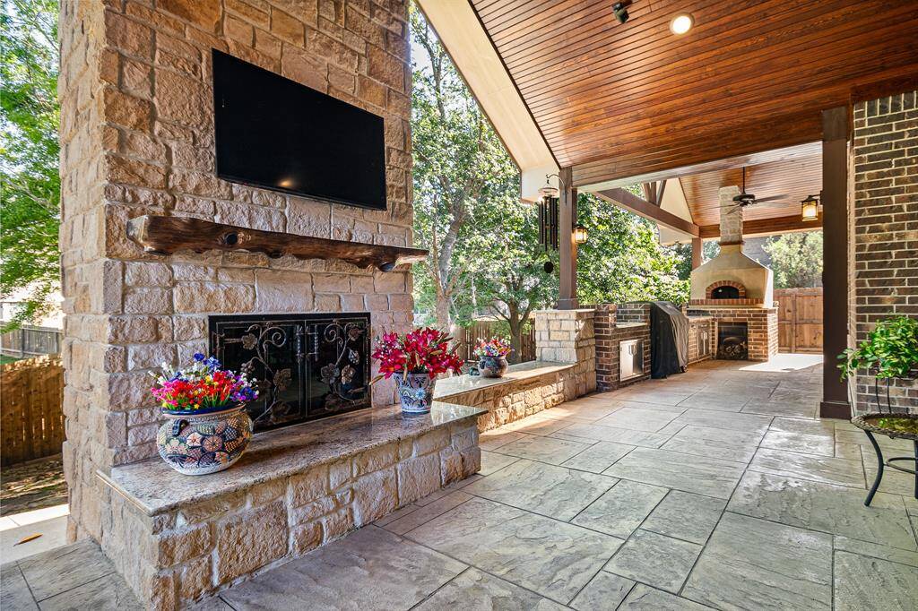 This floor to ceiling Wood Burning Fireplace with gas starter will have everyone wanting to be at your house.  Check out the Cooks area.