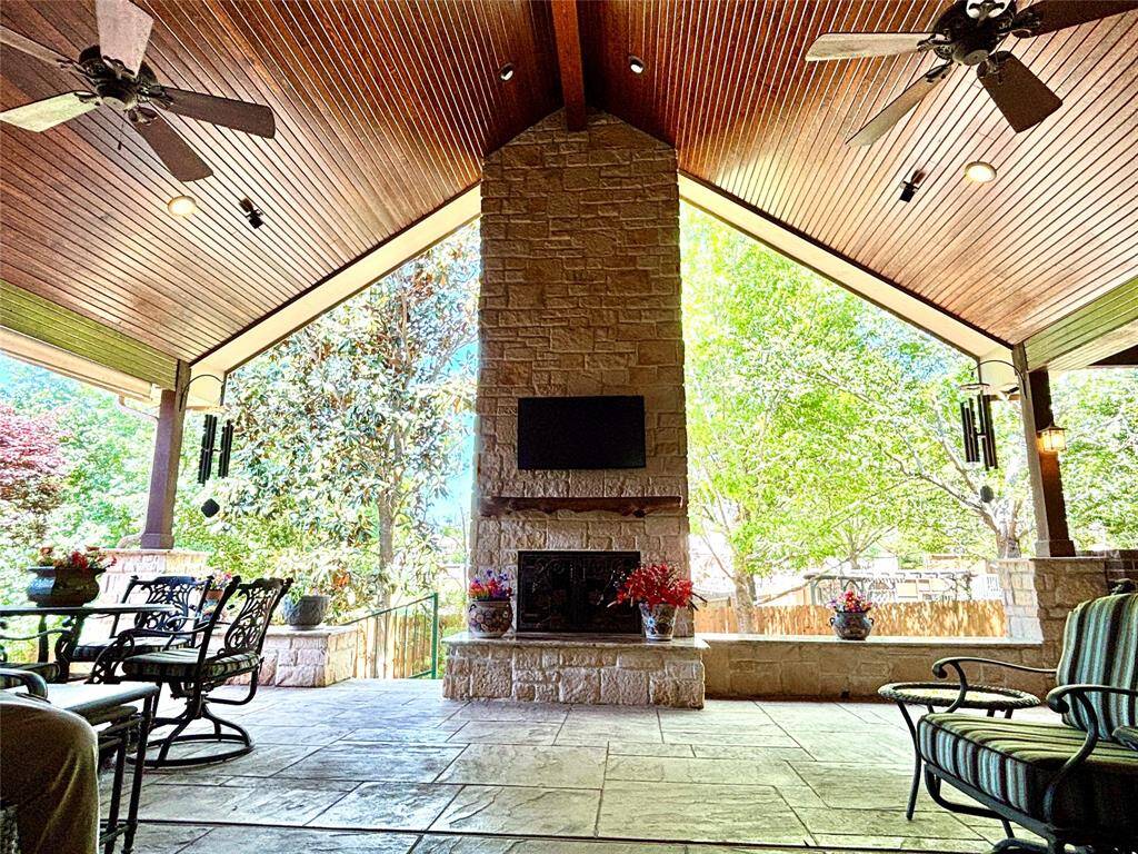 The Outdoor Patio is made for all weathers.  Wood ceiling, speakers and the Fireplace has gas connection and yet be wood burning.  Everything you've been looking for is here!