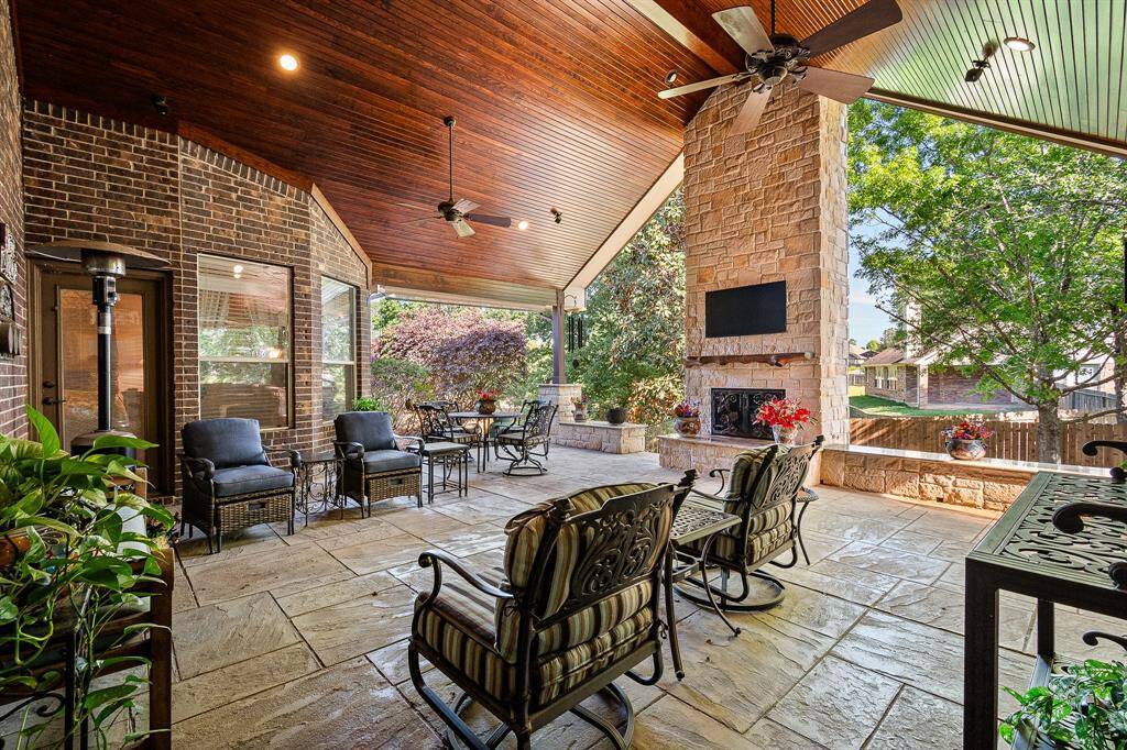 Your fully covered outdoor Patio offers luxurious landscaping, a large water effect.  This will be where you'll want to spend a lot of time all alone or with a multitude of guest.  The Primary Suite is to the left and you'll be able to access it for morning coffee or an evening cocktail.