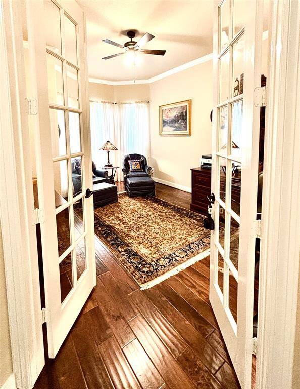 Exquisite glass doors offers privacy into this spacious Study/Office.