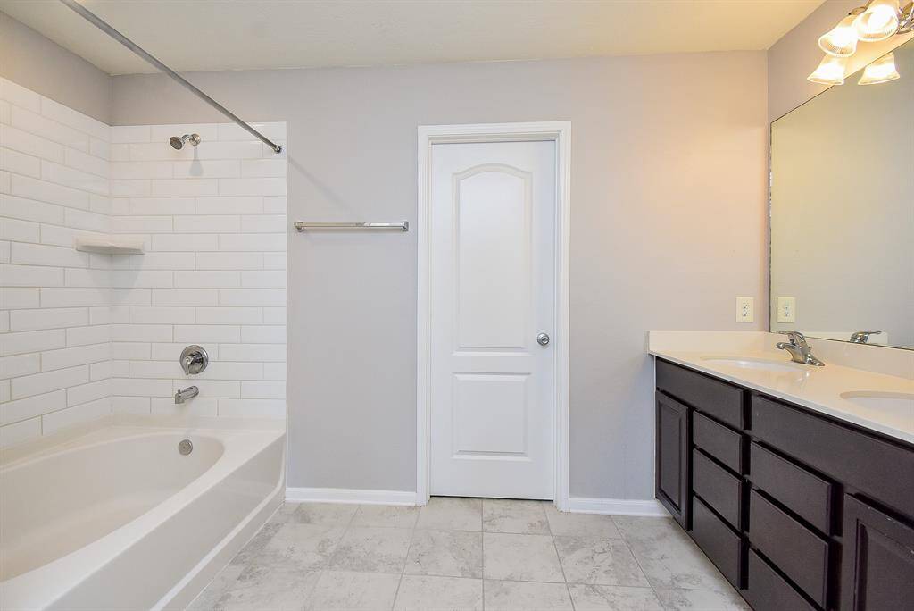Enjoy your own ensuite bath featuring spacious vanity and a combination tub and shower.