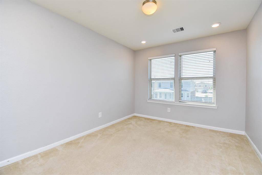 It’s roomy enough for lounging or entertaining. Natural light and soft flooring make it a pleasant spot to hang out. A great bonus space for everyday enjoyment.