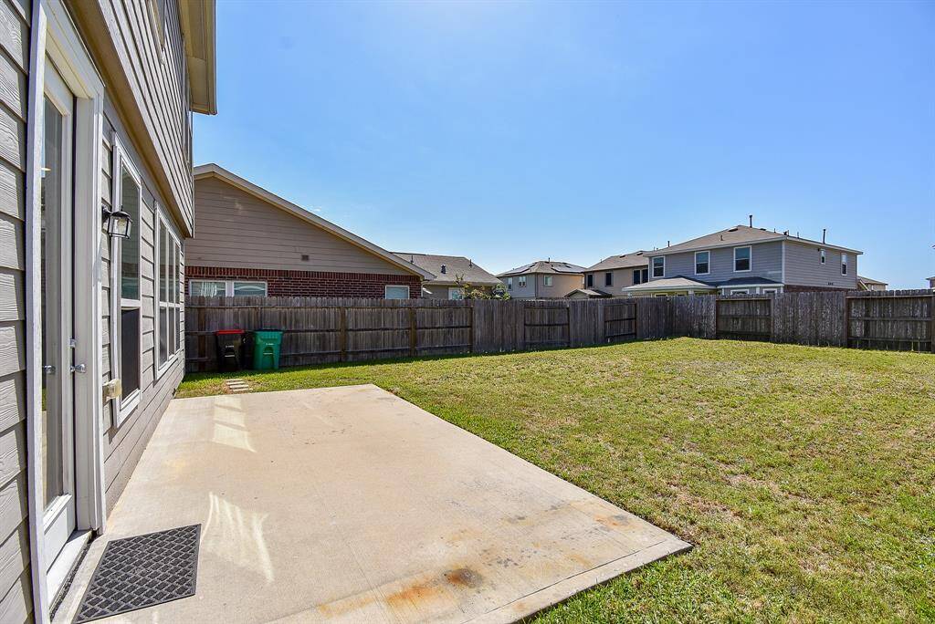 The backyard is a true highlight—spacious, open, and ready for anything.