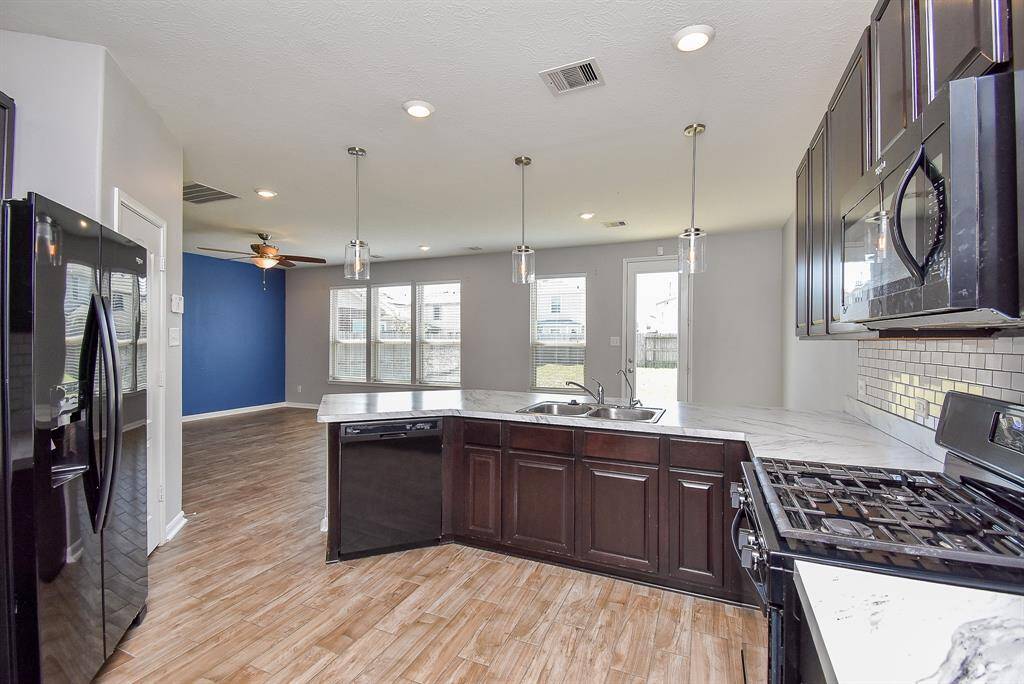 Generous countertops provide plenty of prep space for cooking and baking and ample cabinets keep everything organized.