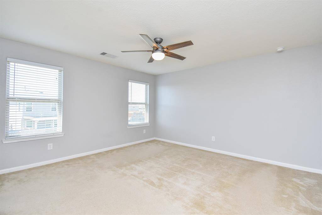 The primary bedroom offers a quiet, relaxing escape from the day.
