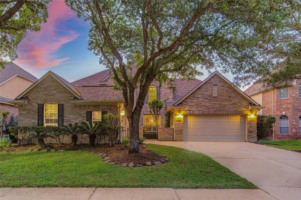 Welcome to 25614 Tower Side—nestled in the heart of Cinco Ranch, this beautifully maintained 2-story home exudes timeless charm with a brick and stone elevation, lush landscaping, and a welcoming front porch.