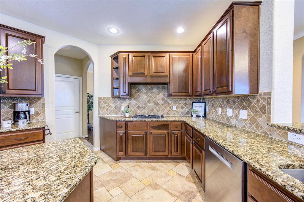 An abundance of counter space and a walk-in pantry make meal prep a breeze.
