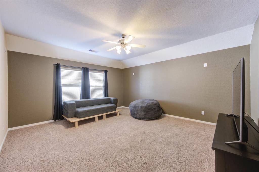 The expansive upstairs game room offers endless possibilities—whether it’s a media room, teen hangout space, playroom, or home gym, there’s room for it all.