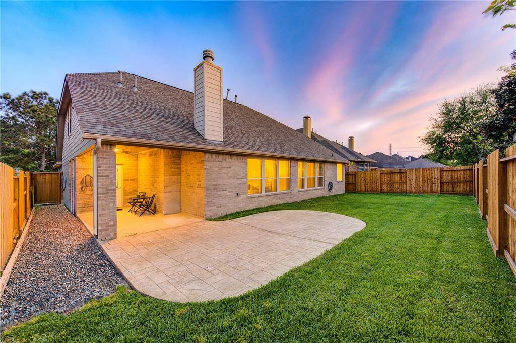 Step outside to a large backyard with a covered patio—ideal for grilling, outdoor dining, or enjoying peaceful evenings. The yard has room for a playset, pool, or garden and is a blank canvas for your outdoor vision.