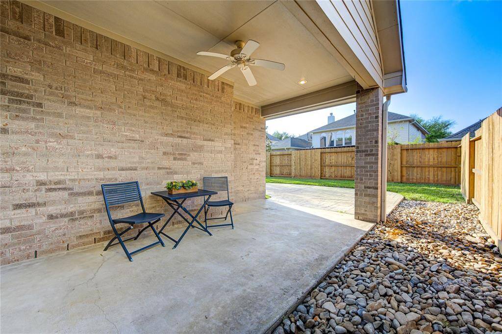 Enjoy outdoor living year-round under the extended covered patio. Whether sipping morning coffee or hosting summer barbecues, this space is designed for comfort and relaxation. The lush lawn is easy to maintain and offers endless potential for customization.