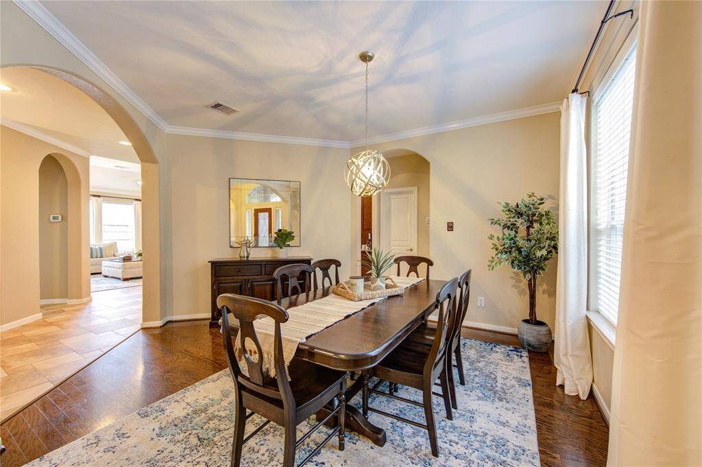 The formal dining room is designed for both comfort and elegance, with plenty of space for a large table and easy access to the kitchen—ideal for hosting holiday meals or dinner parties.