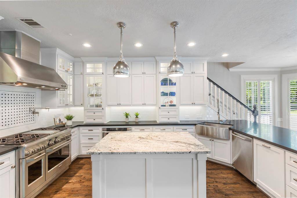 Experience the epitome of luxury in this kitchen, featuring top-of-the-line GE Monogram appliances designed for both style and function.