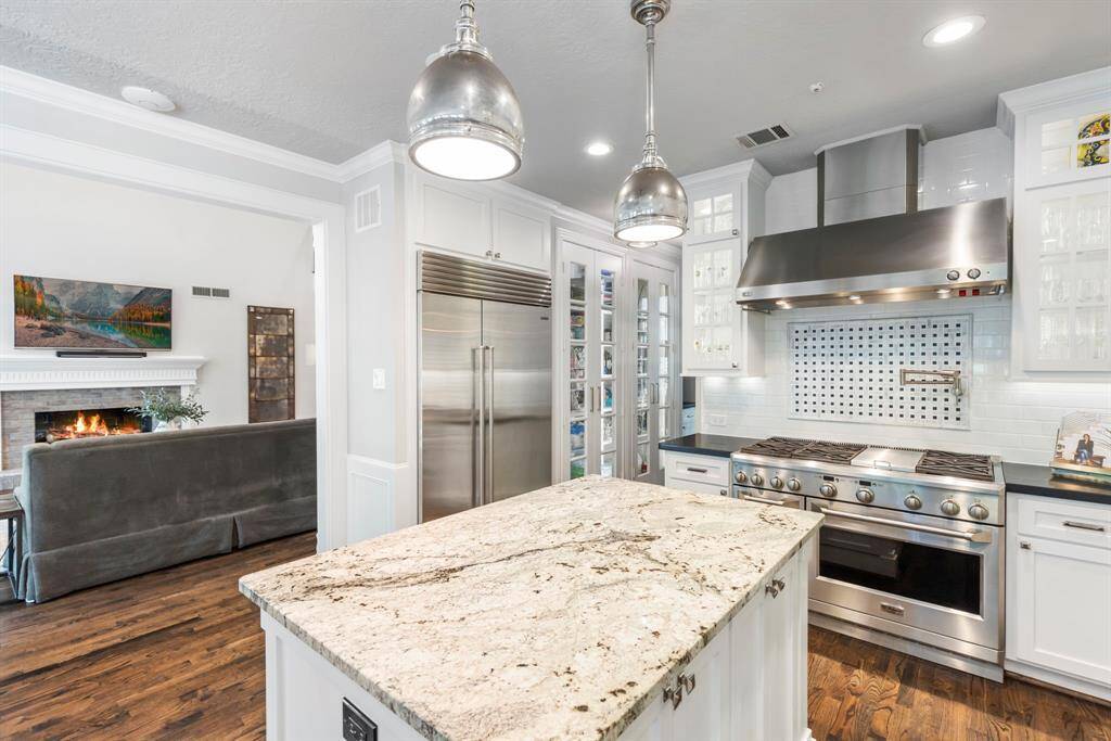 Spacious open floorplan seamlessly connects the living, dining, and kitchen areas—perfect for entertaining guests with ease and style.
