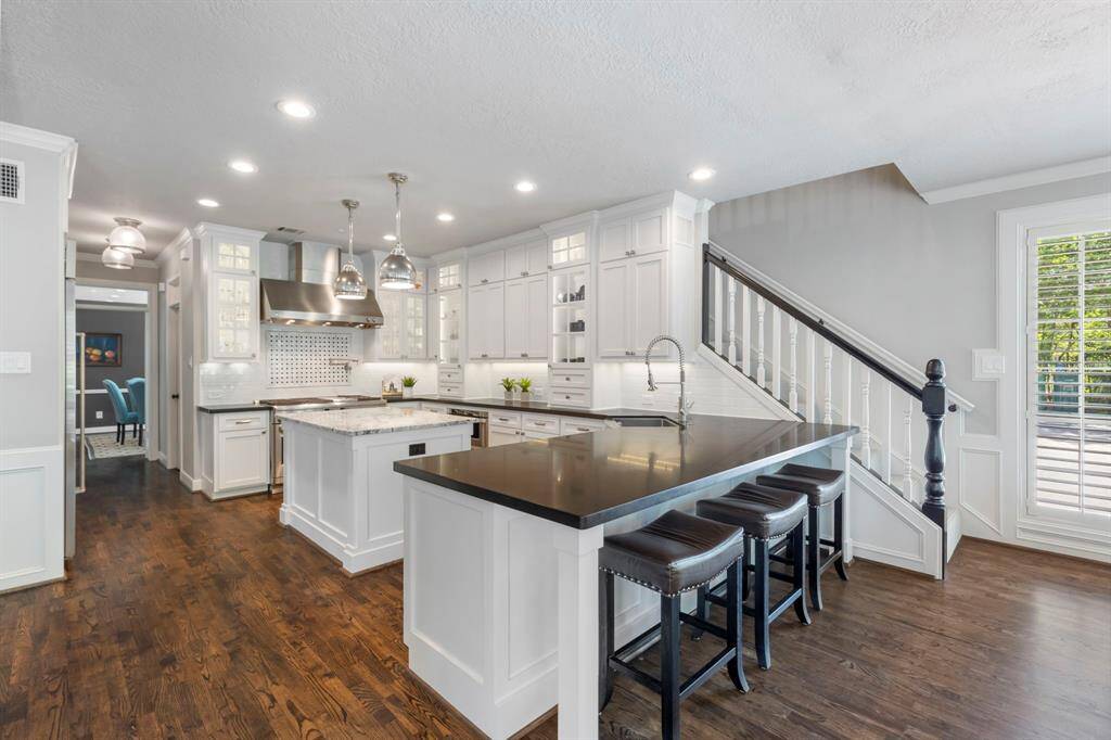 Gorgeous hardwood floors extend throughout the main level, enhancing the home's warmth and sophistication.