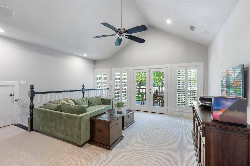 Spacious upstairs family room, perfect for relaxation and gatherings, offering a cozy retreat for entertainment.