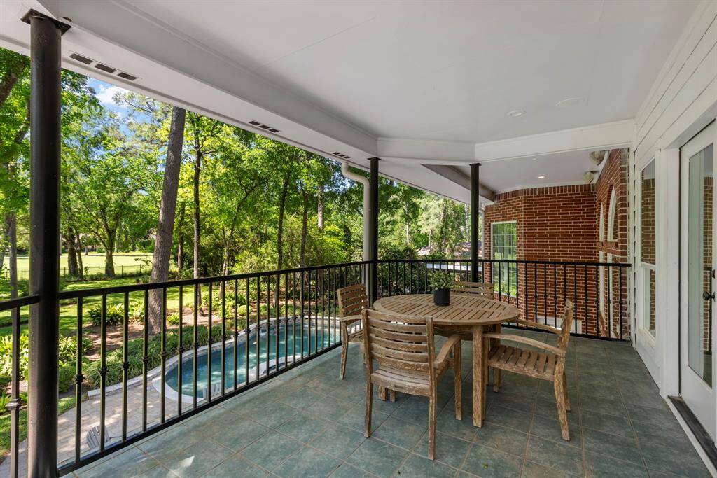 Step onto the balcony off the upstairs family room, offering stunning views of the backyard and the golf course.