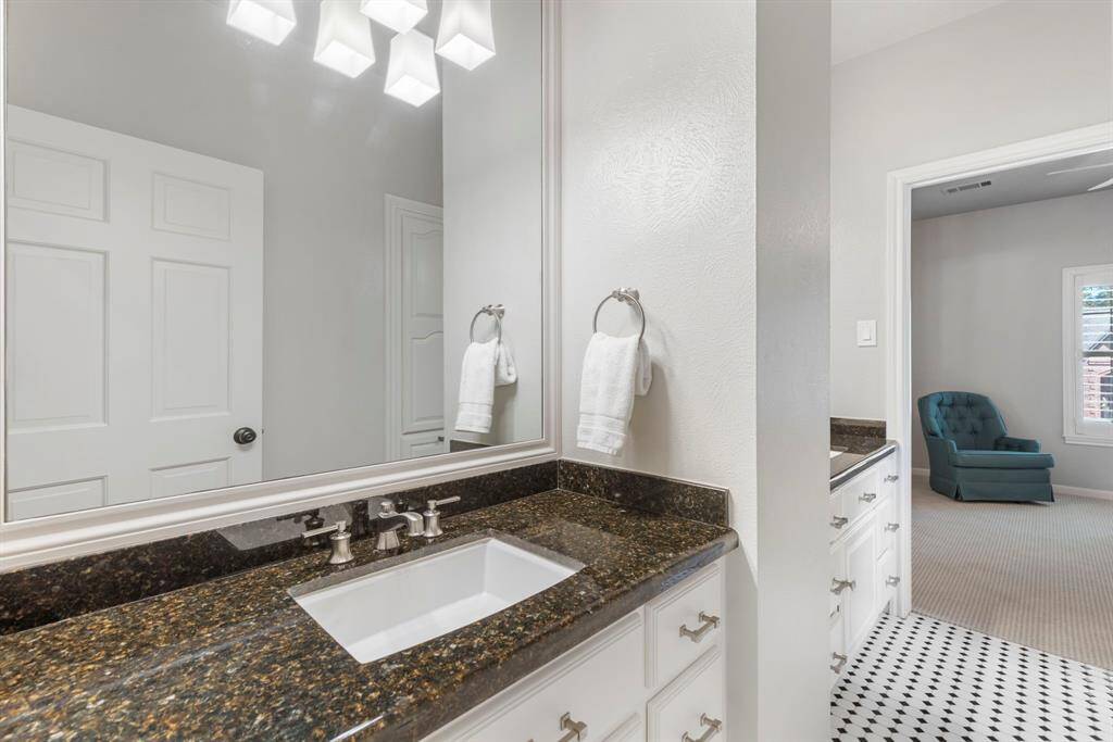 Updated secondary bathroom featuring modern fixtures and finishes.