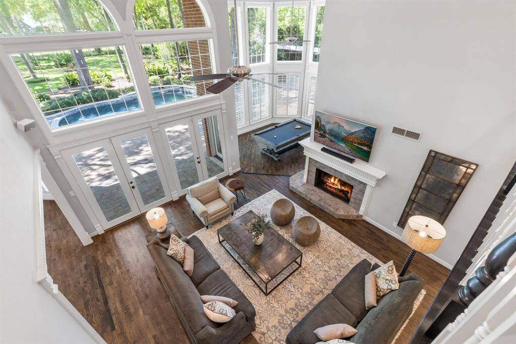 View from the balcony overlooking the main level, providing a stunning perspective of the home's spacious design.