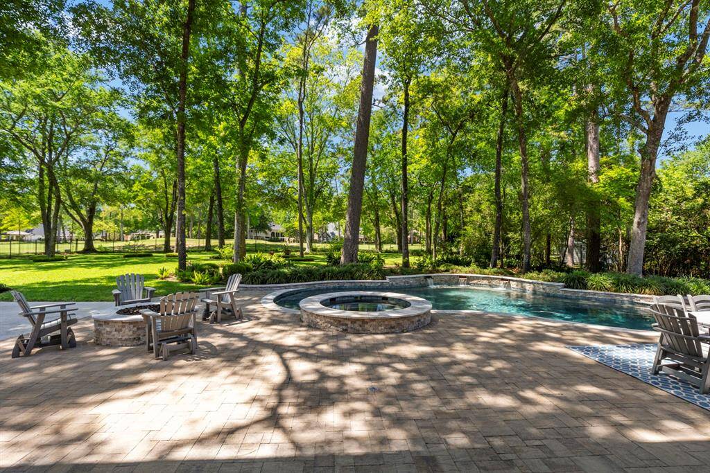 Enjoy the warmth and ambiance of the built-in firepit, perfect for cozy evenings and entertaining in the backyard.