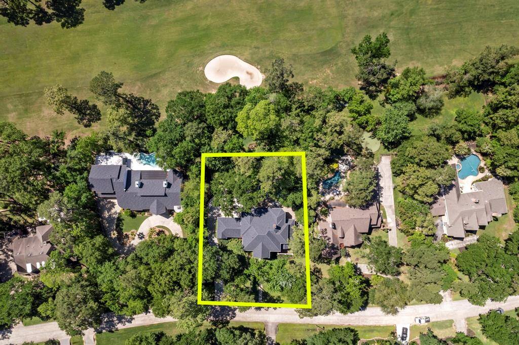 Oversized wooded lot located on the 9th fairway of the West Course, providing serene views and a picturesque setting.