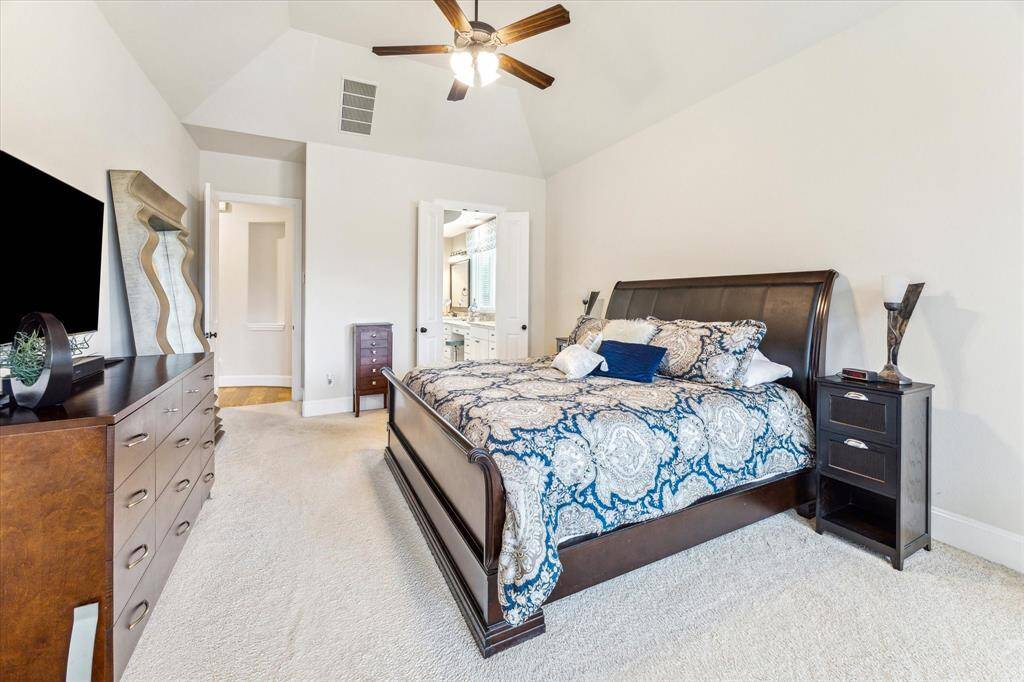 Spacious primary suite with vaulted ceilings