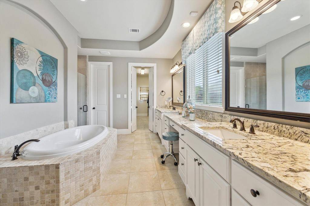 Luxury primary ensuite bathroom with soaker tub, separate shower and double vanity!
