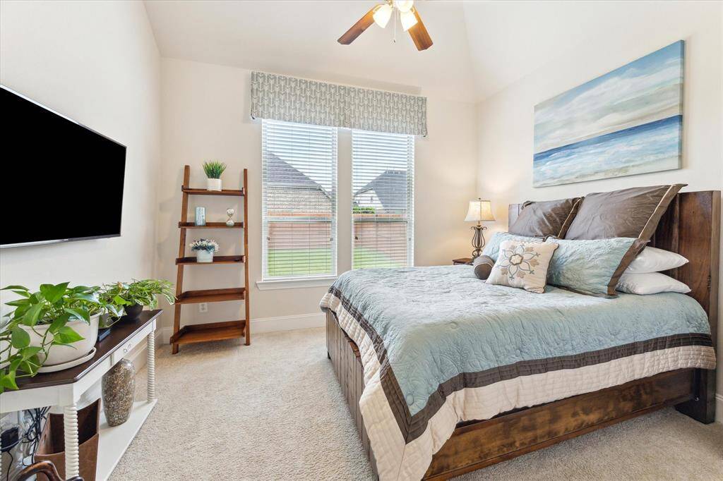 Second bedroom down provides perfect space for multi-gen living or hosting guests