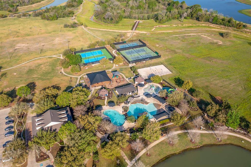 Firethorne Amenities Center! Complete with Gym, Resort style pool including splash pad and slides. Tennis courts, Sand Volleyball courts and playground!