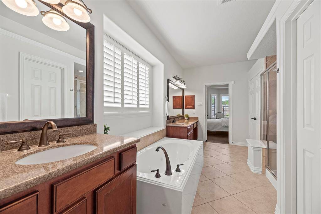 The soaking tub offers a serene retreat, inviting you to unwind and indulge in pure relaxation.