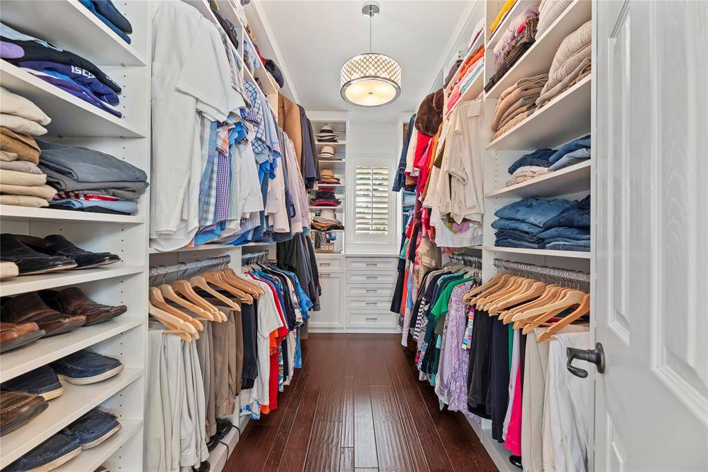 The primary closet provides generous space to store your entire wardrobe while keeping everything neatly organized and easily accessible.