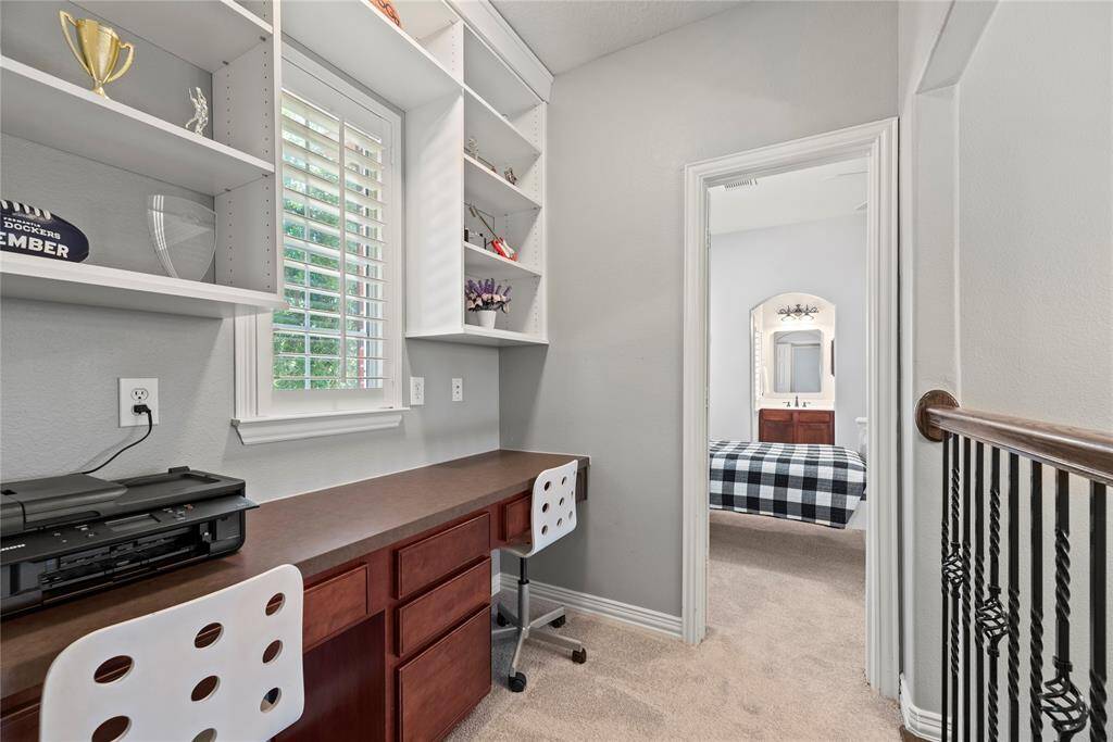 A charming study nook upstairs provides the perfect quiet retreat, ideal for focused work or creative endeavors in a cozy, private setting.