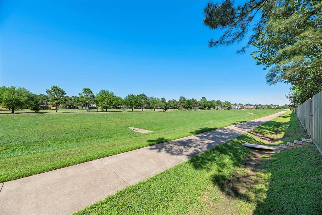 Enjoy the ultimate in convenience and privacy with direct access through the back gate to serene walking paths that wind through lush landscapes.