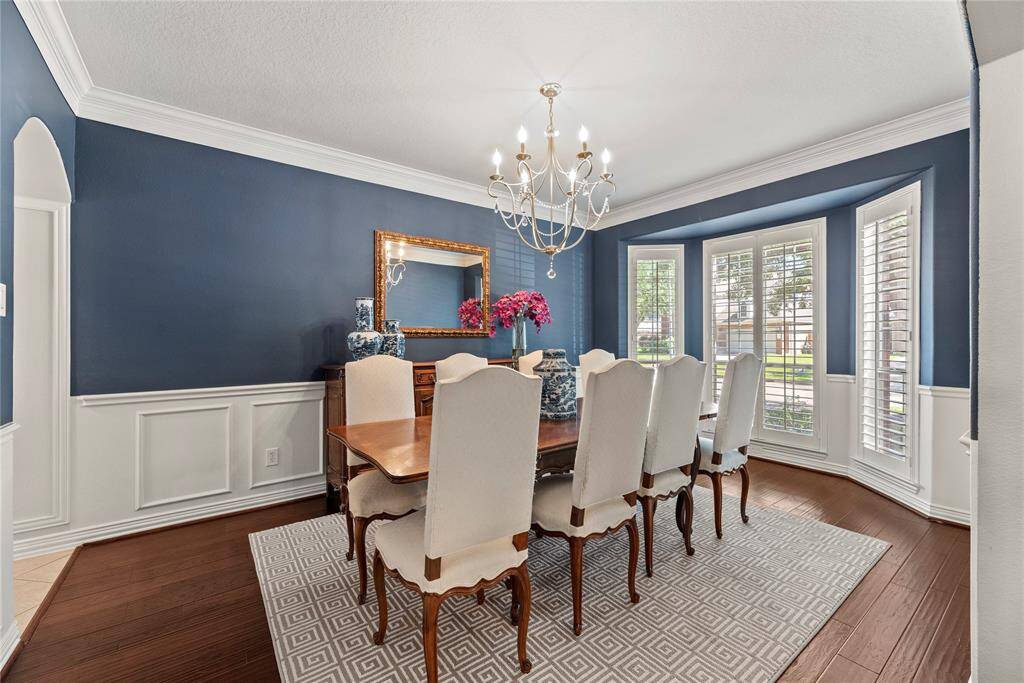 The spacious dining room is designed for effortless entertaining, easily accommodating a large table for gatherings.