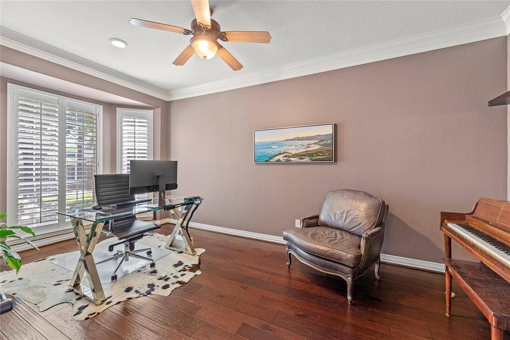 A private study through double glass doors adds a touch of sophistication and privacy to the home. It suggests a space dedicated to concentration, creativity, and productivity.