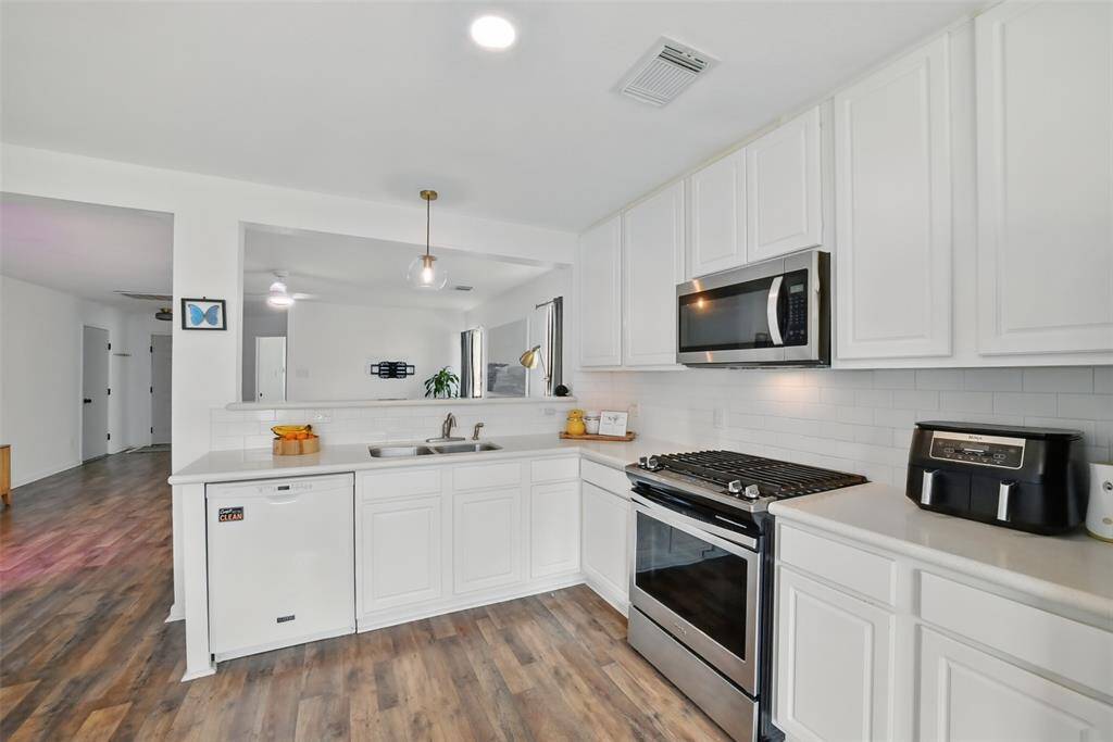 LOTS OF COUNTER SPACE FOR MEAL PREPARATION.