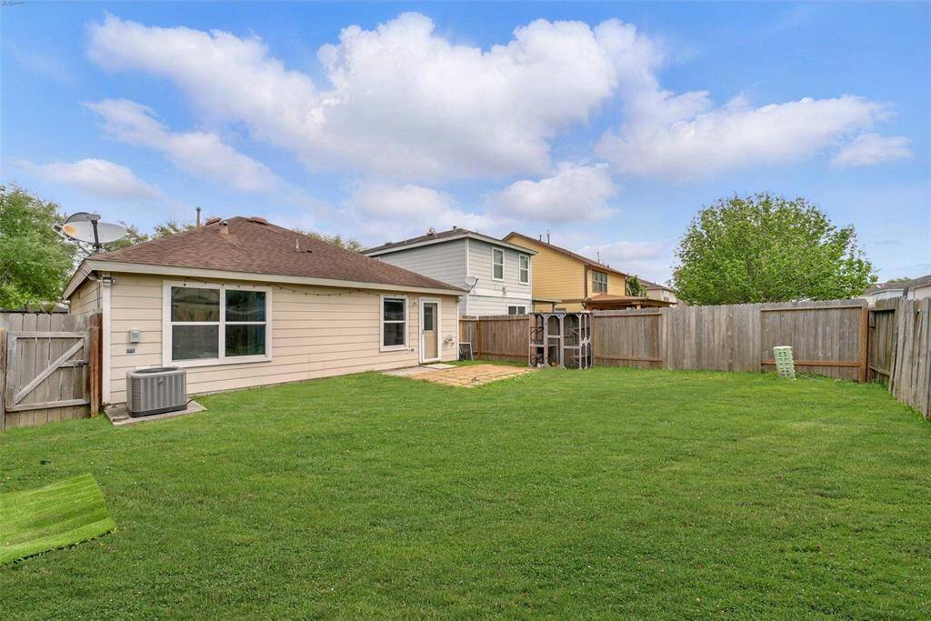 THE BACKYARD HAS PLENTY OF SPACE FOR PETS AND KIDDOS TO ROAM. THE PATIO AREA IS PERFECT FOR SUMMER BARBECUES.