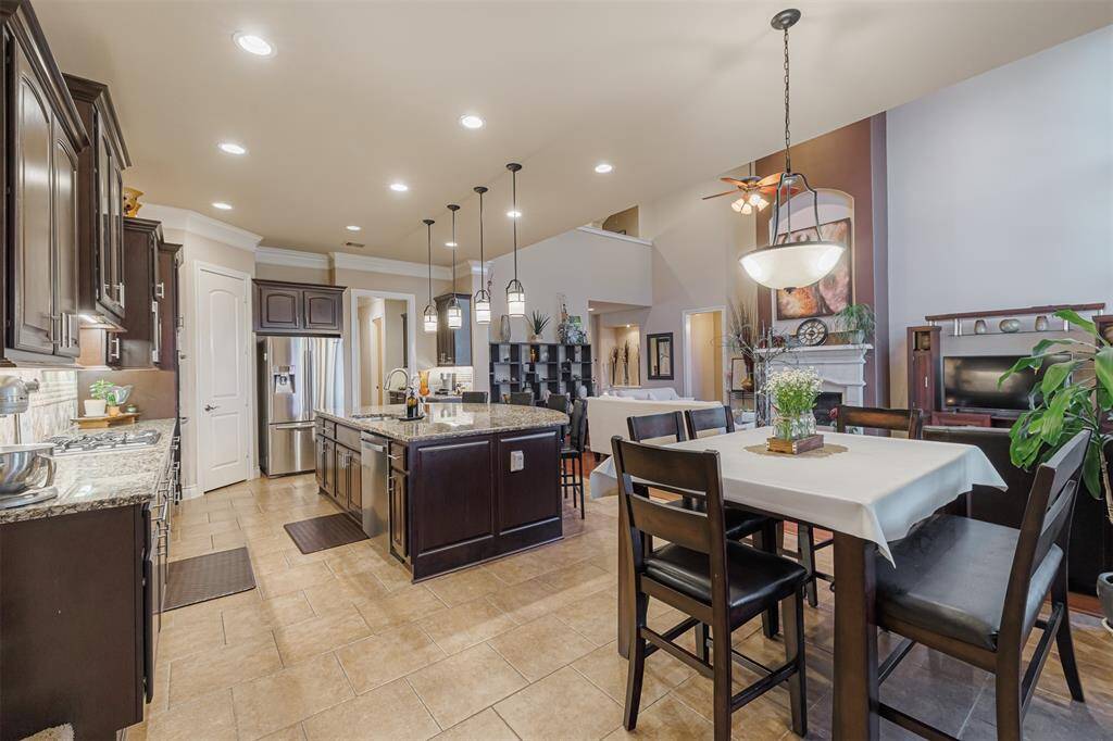 Another view showing the bright and open floor plan between the kitchen, breakfast and family room.