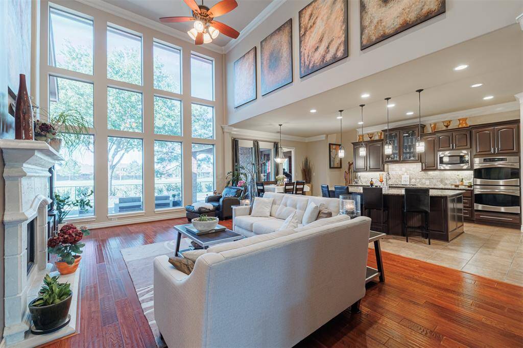 Another view of the family room looking out the wall of windows and towards the kitchen.