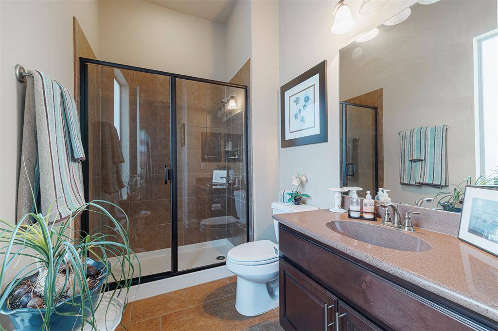 Full bath located off the guest suite located downstairs.